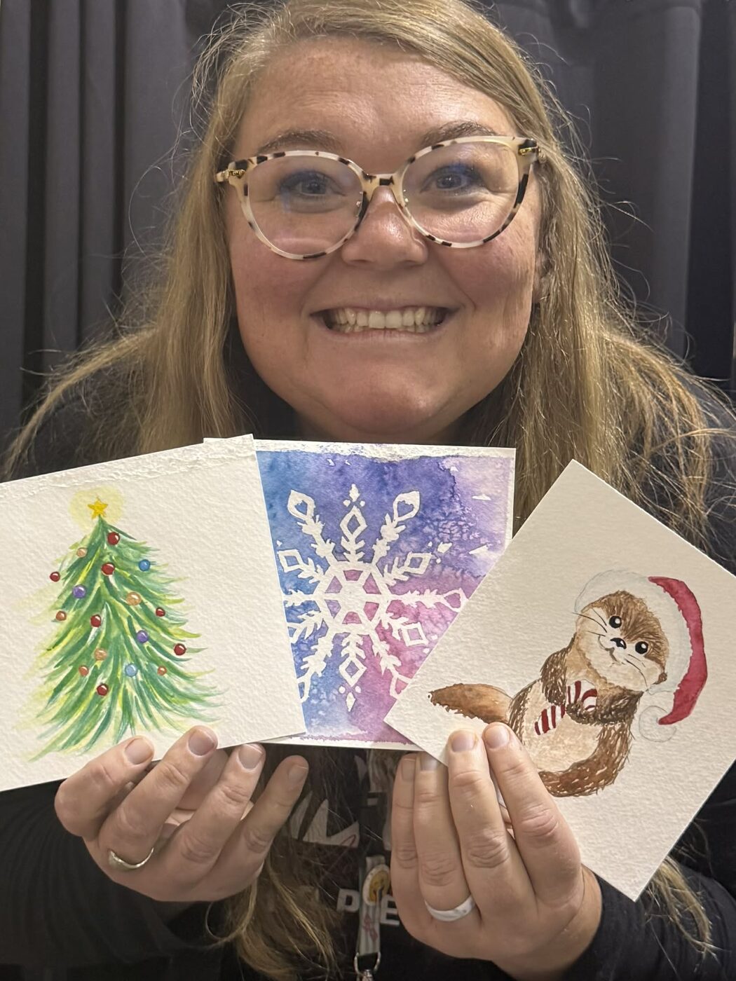 Student showing her watercolor cards